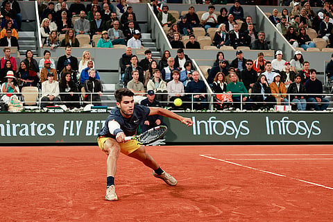 Carlos Alcaraz plays a shot against Jesper de Jong
